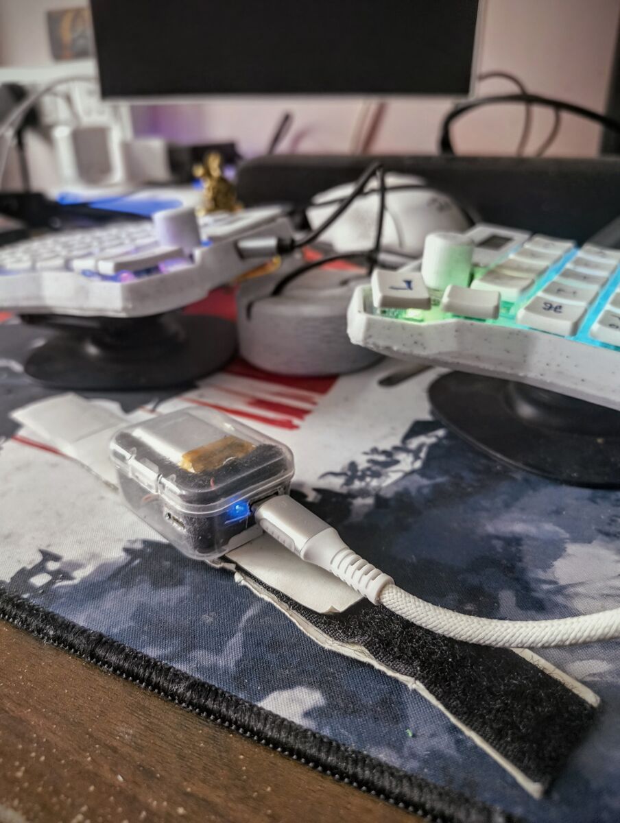 RUNE — plastic box prototype, blue BLE indicator, desk setup