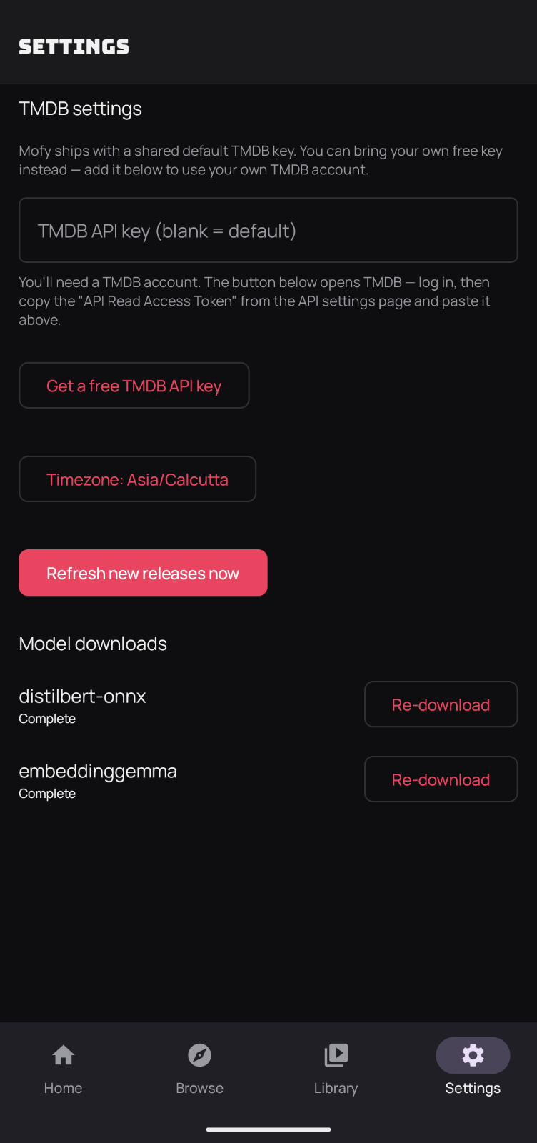 Mofy Settings screen with a TMDB API key field, a Get a free TMDB API key button, and a Model downloads section listing distilbert-onnx and embeddinggemma as complete with Re-download buttons.